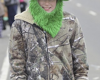 Katie Rickman | The Vindicator.Dalton Stehar, 10, or Austintown walks up Market street with his dog before the St. Patrick's Day Parade in Boardman Sunday afternoon.