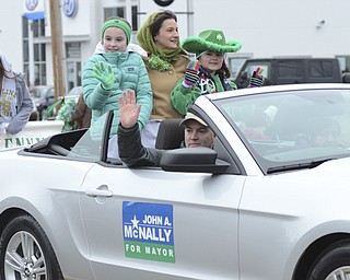 Katie Rickman | The Vindicator.Mayor John McNally and his family wave to the crowd gathered for the St. Patrick's Day Parade in Boardman Sunday afternoon.