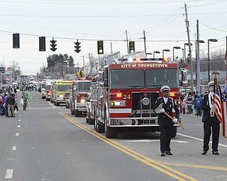 Katie Rickman | The Vindicator.Fire trucks proceed down the parade route during the St. Patrick's Day Parade in Boardman Sunday afternoon.