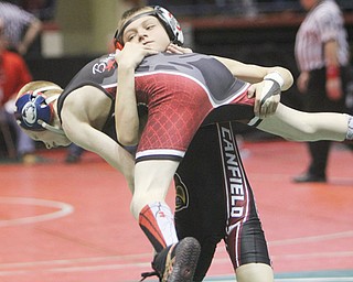 Canfield Wrestling Club’s Ethan Fletcher prepares to body slam Knick Andrew during the third place round of
the OAC Grade School State Championship wrestling meet at the Covelli Centre on Sunday. Fletcher finished third.