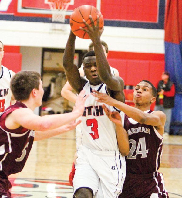 Fitch’s Jesse Driver makes his way to the hoop past Boardman’s Alex Duda (5) and Brandon Rozzi (24). Driver was honored Monday as one of the top players in the state by the Associated Press with a spot on the Division I All-Ohio second team.