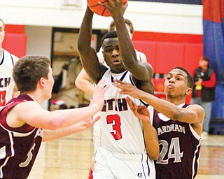 Fitch’s Jesse Driver makes his way to the hoop past Boardman’s Alex Duda (5) and Brandon Rozzi (24). Driver was honored Monday as one of the top players in the state by the Associated Press with a spot on the Division I All-Ohio second team.