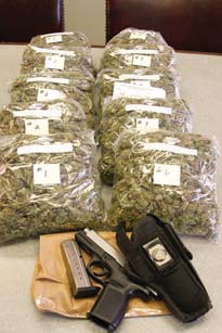 A traffic stop on the South Side resulted in more than a citation. Vice squad officers on patrol late Saturday
seized about 10 pounds of suspected marijuana with a street value of $20,000 and a semiautomatic handgun in
a vehicle driven by an East Side man on West Earle Avenue.