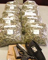 A traffic stop on the South Side resulted in more than a citation. Vice squad officers on patrol late Saturday
seized about 10 pounds of suspected marijuana with a street value of $20,000 and a semiautomatic handgun in
a vehicle driven by an East Side man on West Earle Avenue.