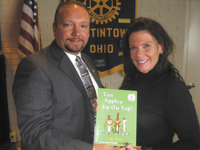 SPECIAL TO THE VINDICATOR
Austintown Rotary welcomed Susan DeLeo, above, representative of Trumbull Career & Technical Center, as the guest speaker at a recent meeting. TCTC is leading the effort to prepare students for jobs in the oil and gas industry. Mark Cole, Rotary president, presented a book to DeLeo for the Austintown Elementary School Library in honor of her presentation.