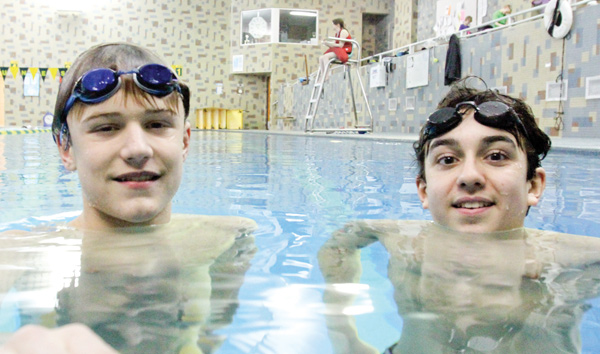 Y-Neptunes teammates Jordan Stackpole, left, and Noah Basista practice in the pool at the Youngstown YMCA. The boys will be competing this weekend in Columbus at the Great Lakes Zone Championships at Ohio State
University.
