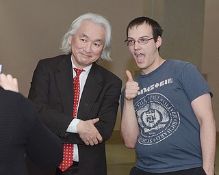 Physicist Michio Kaku poses with YSU student Dan Gallo of Hubbard before speaking to a group of students Thursday afternoon at Stambaugh Auditorium. Kaku also spoke Thursday evening to an audience at the historic North Side auditorium.