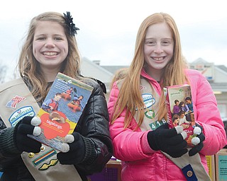 Holly Goransson, left, of Liberty and Isabella Minotti of Girard, both 12, sell Girl Scout cookies outside the One Stop Mart in Liberty. The two Girl Scouts attend St. Rose School in Girard and together have sold more than 2,000 boxes of cookies. They hope to reach 2,000 each.