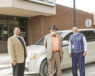 From left, Joseph Hightower, Robert Faulkner and Lyudee Womack stand in front of a new van purchased with grant money by the United Methodist Community Center to transport veterans to appointments and help eliminate barriers to jobs.