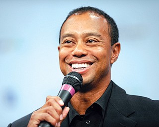 Tiger Woods speaks at a news conference at the Newseum in Washington on Monday during an announcement for the Quicken Loans National at Congressional in Bethesda, Md., in June. Woods is unsure if his ailing back will allow him to play in The Masters in two weeks.