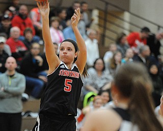 HOWLAND, OHIO - MARCH 25, 2014: McKenna Shives #5 of Struthers takes a three point shot during the second half of Tuesday nights Frank Bubba Classic girls basketball all-star game at Howland High School. Mahoning County won 67-62.