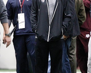 Texas A&M QB Johnny Manziel watches at the Aggies’ Pro Day. Manziel is one of the players that the Browns will be looking at to possibly choose with their No. 4 overall draft pick.