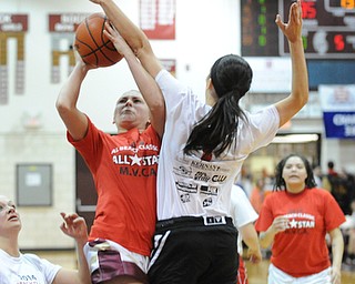 David W. Dermer | The Vindicator
BOARDMAN, OHIO - MARCH 26, 2014: Leah Leshnack of Liberty goes to the basket while avoiding the block from Ashleigh Ryan of Struthers during the 2014 Al Beach All Star game Wednesday night at Boardman High School.
