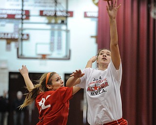 David W. Dermer | The Vindicator
BOARDMAN, OHIO - MARCH 26, 2014: Megan Sefcik of Fitch puts up a shot over Gabby Cvengros of Howland  during the 2014 Al Beach All Star game Wednesday night at Boardman High School...