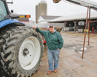 Wayne Greier, owner of Greier Ag Center, gets a fertilizer spreader ready as he prepares to start the year.