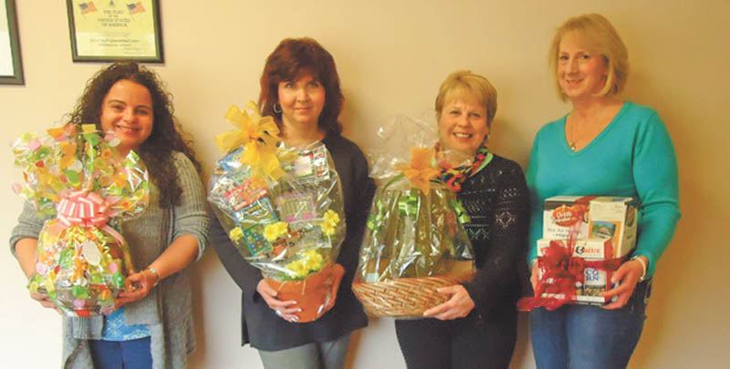 SPECIAL TO THE VINDICATOR
Christine Hogan; Chris Racketa, lead singer of the band After Hours; Paulette Kren and Laura Carey-D’Rummo are holding a few of the baskets that will be included in the basket auction at Girard Multi-Generational Center’s Spring Fling dinner. The event will take place from 6 to 10 p.m. Saturday at Mahoning Country Club, 710 E. Liberty St., Girard. After Hours will provide music, and there will be a cash bar and a 50-50 raffle. Donations of $25 are requested per person. The proceeds will benefit the Girard Multi-Generational Center. For information call the center at 330-545-6596.
