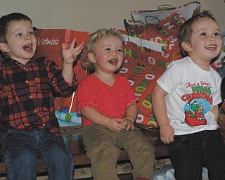 Laurie Fox’s grandsons’ gleeful faces are watching others in the family opening presents this past Christmas. From left are Cameron, son of Beth and Matt Mason of Salem, and Jack and Ben, sons of Becky and Bill Gaither of Austintown.