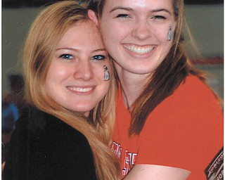 The Youngstown State University girls' track team won the Horizon League in February at the Watts Centre. High jumpers Leanna Hartsough and MacKenzie Sturtz are all smiles as they bask in the team's success. This photo was taken by Lana VanAuker.
