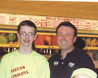 Ken Yokobosky, professional bowler and coach from New Jersey, posed for a photo between frames with a bowler from Austintown at the Hubbard Open Pro-Am on March 14. Photo by Doxie Damico of Austintown.