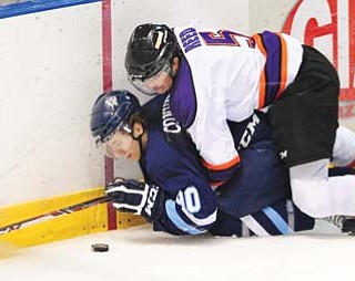 Youngstown’s Truman Reed, top, will be one of several Phantoms players who will be suiting up as juniors for
the last time in this weekend’s season fi nales at the Covelli Centre before heading off to college.