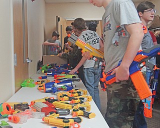 Players who don’t have a NERF blaster choose from an assortment that organizer Curtis Schaffer brings to each “NERFing for Jesus” event. The sport is the brainchild of Schaffer of First Christ Church in Salem as a way to help the community and bring churches together.