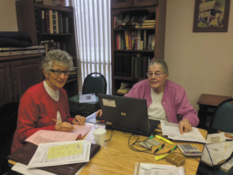 SPECIAL TO THE VINDICATOR
On the right is Judy Zimmer of Howland, AARP volunteer tax preparer, filing taxes for Des Puhak, also of Howland. The Niles S.C.O.P.E. Senior Center, 14 E. State St., is continuing AARP tax preparation through Friday. There are at least five preparers on site each Friday. Appointments must be made by calling the center at 330-544-3676.