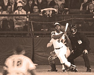 The Braves’ Hank Aaron watches the flight of the ball after hitting his 715th career homer to break Babe
Ruth’s record in a game against the Dodgers in Atlanta. The 40th anniversary of the event will be commemorated
tonight before the Braves’ home opener against the Mets.