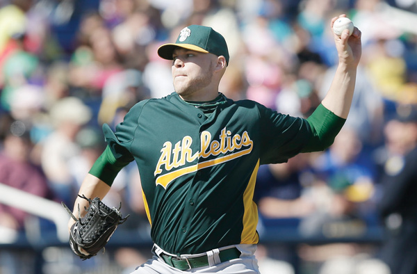 Former Youngstown State pitcher Justin Thomas throws during an exhibition spring training baseball game against the Milwaukee Brewers. Thomas, who has pitched all over the country and in Japan since leaving YSU, is now a starter with the Angels’ Triple-A team: the Salt Lake Bees.