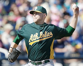 Former Youngstown State pitcher Justin Thomas throws during an exhibition spring training baseball game against the Milwaukee Brewers. Thomas, who has pitched all over the country and in Japan since leaving YSU, is now a starter with the Angels’ Triple-A team: the Salt Lake Bees.