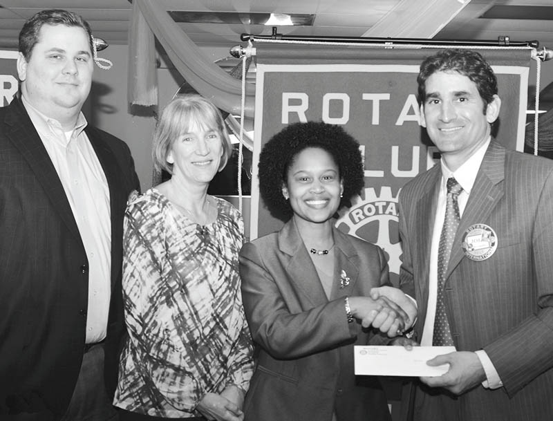 SPECIAL TO THE VINDICATOR
At the March 19 meeting of the Rotary Club of Warren, President John Campolito presented a check for $10,000 to Kenya Roberts-Howard, YWCA executive director, and Shari Harrell, past YWCA executive director. The check is the final installment of a pledge made three years ago toward the YWCA’s building/renovation drive. Harrell secured the $30,000 pledge from the Rotary Club of Warren in 2012. The pledge helped to fund construction of a project that will provide safe housing for women in transition. Harrell is the president and CEO of the Community Foundation of the Mahoning Valley. From left to right are Nick Odille, past president of Rotary of Warren; Harrell; Roberts-Howard; and Campolito.