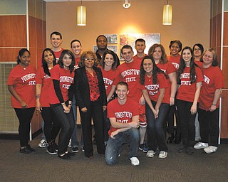 SPECIAL TO THE VINDICATOR
Dr. Joan L. Boyd is chairwoman of the committee organizing the 300 Sisters in Red Health Fair. Above, she stands with student volunteers from Youngstown State University.