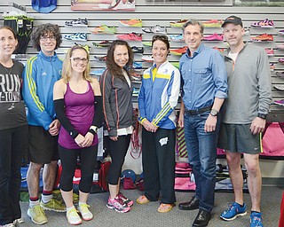 A group of runners who meet at Second Sole shoe store in Boardman will participate in today’s Boston Marathon one year after the terror bombing that killed three people and injured more than 260. From left are Jaclyn Disibio of Poland, Jonathan Bolha of Austintown, Amy Pagac of Boardman, Tammy McFarland of Austintown, Jane Timmins of Huron, Dr. Vincent Marino of Poland and Kevin Guthrie of Struthers.