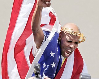 Meb Keflezighi of San Diego, Calif., celebrates his victory in the 118th Boston Marathon on Monday in Boston. Keflezighi became the first American man to win the race since 1983. Shalane Flanagan of Portland, Ore., was the
top American finisher among the women in seventh place.