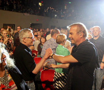 William D. Lewis | The Vindicator .Film star Kevin Costner performs with his band Modern West to a large crowd at Packard Music Hall in Warren 4-22-14. Shown here greeting fans upon entering the hall.