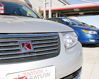 Unsold 2006 Ion coupes sit outside a Saturn dealership in the south Denver suburb of Highlands Ranch,
Colo. According to government documents released Saturday, General Motors waited years to recall nearly 335,000 small cars for power-steering failures despite getting thousands of consumer complaints and more than 30,000 warranty repair claims. Meanwhile, the company and a group of trial lawyers are ready to battle over
bankruptcy protections.