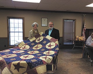 SPECIAL TO THE VINDICATOR
Bonnie Naman, a member of That Quilt Group I Belong To in Canfield, recently presented a patriotic quilt to Jan Seidler, business development coordinator of Hospice of the Valley. The quilt will be used by military service members who are patients at Hospice House in Poland. The quilt group also creates quilts for terminally ill patients at Hospice House. TQGIBT will sponsor a Quilt Happening from 9 a.m. to 3 p.m. May 10 at Fair Park, 30 Parkside Circle, in Canfield. Shirley Stutz, nationally known machine quilter, will teach freehand machine quilting. The cost is $35 per person with lunch included. Reservations are required. Call 330-538-3559.