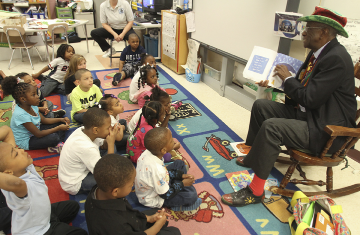 William D Lewis  The Vindicator Wally Amos, The Cookie Kahuna, reads to kindergarten students at MLK school in Y-town 4-25-14. Amos is founder of Famous Amos Chocolate Chip Cookies and visite schools in hte area reading to students.