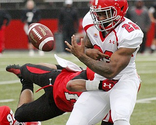 William D Lewis the Vindicator YSU Martin ruiz(22) fumbles after being hit byEric Thompson(14) during Red White game 4-25-2-14.