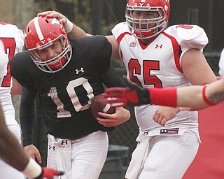William D Lewis the Vindicator YSU QB Ricky Davis(10) gets congrats fromStephen Page (65) after scoring during Red White game 4-25-2-14.