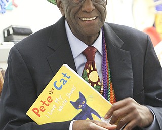 William D Lewis  The Vindicator Wally Amos, The Cookie Kahuna, reads to kindergarten students at MLK school in Y-town 4-25-14. Amos is founder of Famous Amos Chocolate Chip Cookies and visite schools in hte area reading to students.