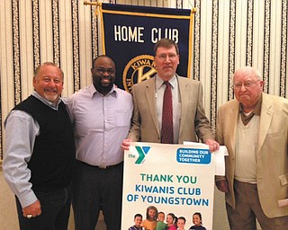 SPECIAL TO THE VINDICATOR
The Downtown Kiwanis Club presented a $1,500 check to YMCA president/CEO Timothy Hilk, representing the club’s annual commitment to the Y’s various youth programs. The presentation took place at the club’s regular meeting March 21. Afterward, Hilk and club members were entertained by Bob DiBiasio, Cleveland Indians senior vice president of public affairs, as he made his annual spring visit to the Downtown Club for his 2014 Tribe update. From left are DiBiasio; Brad Harris, Kiwanis Club president; Hilk; and Charlie Rudibaugh, club member and good friend of DiBiasio.