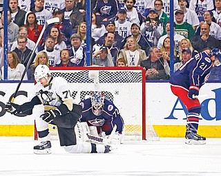Penguins center Evgeni Malkin celebrates scoring a goal past Blue Jackets goalie Sergei Bobrovsky in the first period of Game 6 of their NHL Eastern Conference quarterfinal at Nationwide Arena in Columbus. Malkin scored three goals for the Penguins, who held off the Blue Jackets to win the game 4-3 and the series 4-2.