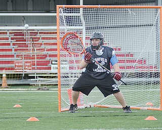 Canfield’s Jacob Duda, 17, catches the ball during a recent lacrosse practice at Canfield High School.