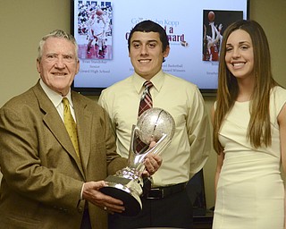 Katie Rickman | The Vindicator.John Kopp presents Evan Standohar and Brittany Zupko with the John Kopp Heart of a Champion Award at the Betras, Kopp, & Harshman office in Canfield May 7, 2014.