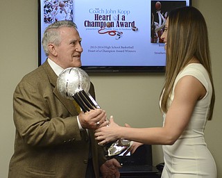 Katie Rickman | The Vindicator.John Kopp presents Brittany Zupko with the John Kopp Heart of a Champion Award at the Betras, Kopp, & Harshman office in Canfield May 7, 2014.