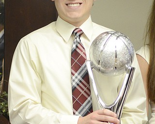 Evan Standohar holds a trophy after being presented with the John Kopp Heart of a Champion award May 7, 2014.