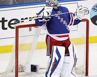 Rangers goalie Henrik Lundqvist looks at the scoreboard Sunday in the final moments of Game 6 of the Eastern Conference semifinals against Pittsburgh in New York. The Rangers defeated the Penguins, 3-1, to even up the series 3-3 and set up Game 7 tonight in Pittsburgh.