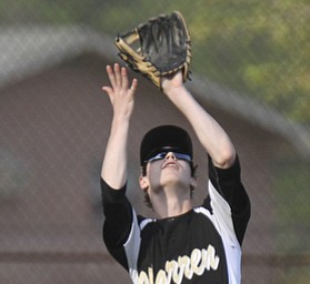 William D.Lewis The Vindicator  Boardman's Lou Cardona(24) is safe at first as Warren's Doug Painter(20) catches a fly ball during 5-13-2014 action at Boardman.