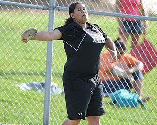 CANFIELD, OHIO - MAY 13, 2014: Cheyenne Wilson of Howland throws the discus during the AAC Red Tier Division track meet at Canfield High School. (Photo by David Dermer/Youngstown Vindicator)