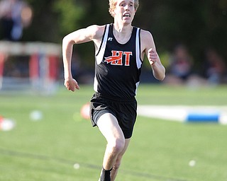 CANFIELD, OHIO - MAY 13, 2014: Ryan Sullivan of Howland sprints to the finish line ahead of the pack during the boys 1600 meter run during the AAC Red Tier  Division track meet at Canfield High School. (Photo by David Dermer/Youngstown Vindicator)